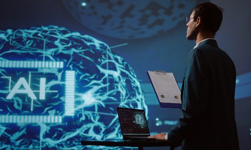 Startup employee looking over business charts, using AI software to take data driven decisions in tech industry. IT expert developing innovative artificial intelligence solutions for company, camera B
