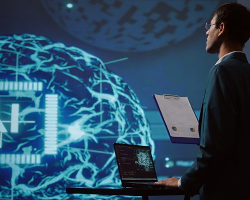 Startup employee looking over business charts, using AI software to take data driven decisions in tech industry. IT expert developing innovative artificial intelligence solutions for company, camera B